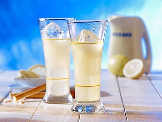 11121967-Two-glasses-of-Pernod-with-ice-cubes-lemons-and-breadsticks